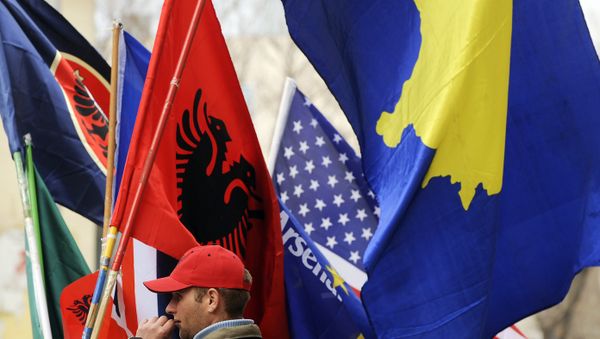 A Kosovo Albanian man sells flags in Pristina on February 16, 2011 in preparation for the third anniversary of Kosovo's declaration of independence - Sputnik International