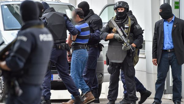 A suspected member of the Islamic State jihadist group is led away by Austrian police from the court in Linz, Austria, on July 27, 2016 - Sputnik International