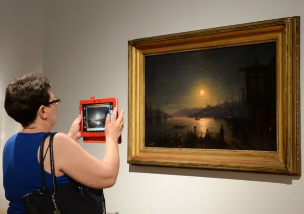 A visitor is seen near the painting Lunar Night in Constantinople displayed at the Ivan Aivazovsky. 200th Birthday exhibition at the Tretyakov Gallery on Krymsky Val in Moscow A visitor is seen near the painting Lunar Night in Constantinople displayed at the Ivan Aivazovsky. 200th Birthday exhibition at the Tretyakov Gallery on Krymsky Val in Moscow - Sputnik International
