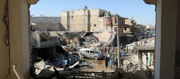 People inspect a site hit by airstrikes in the rebel held town of Atareb in Aleppo province, Syria, July 25, 2016 People inspect a site hit by airstrikes in the rebel held town of Atareb in Aleppo province, Syria, July 25, 2016 - Sputnik International