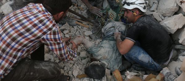Syrian civil defence volunteers remove the body of a man from the rubble of destroyed buildings following reported airstrikes on April 27, 2016 in the rebel-held eastern neighbourhood of Bab al-Nayrab in the city of Aleppo Syrian civil defence volunteers remove the body of a man from the rubble of destroyed buildings following reported airstrikes on April 27, 2016 in the rebel-held eastern neighbourhood of Bab al-Nayrab in the city of Aleppo - Sputnik International