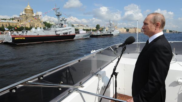 Russian President Vladimir Putin on the Serafim Sarovsky boat during a parade of ships held to celebrate the Navy Day in St. Petersburg - Sputnik International