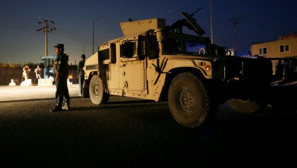 Afghan policemen keep watch near the site of a blast in Kabul, Afghanistan August 1, 2016 - Sputnik International