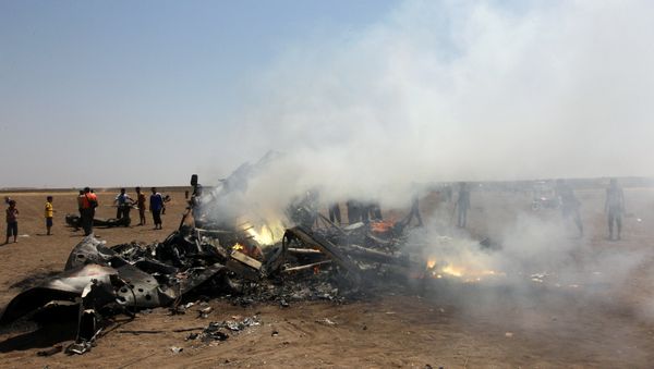 Rebel fighters and civilians inspect the wreckage of a Russian helicopter that had been shot down in the north of Syria's rebel-held Idlib province, Syria - Sputnik International