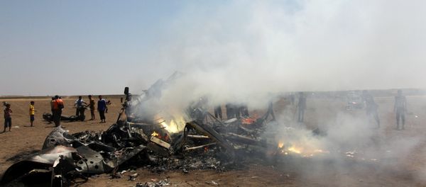 Rebel fighters and civilians inspect the wreckage of a Russian helicopter that had been shot down in the north of Syria's rebel-held Idlib province, Syria Rebel fighters and civilians inspect the wreckage of a Russian helicopter that had been shot down in the north of Syria's rebel-held Idlib province, Syria - Sputnik International