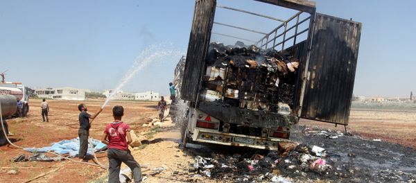 Men try to put out a fire of a loaded truck after an airstrike on a truck parking lot in the rebel-held town of Atareb in Aleppo province, Syria August 3, 2016 Men try to put out a fire of a loaded truck after an airstrike on a truck parking lot in the rebel-held town of Atareb in Aleppo province, Syria August 3, 2016 - Sputnik International