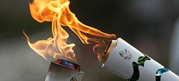 Brazilian residents pass the Olympic torch at Independence Park upon the flame's arrival in Sao Paulo, Brazil, on July 24, 2016 Brazilian residents pass the Olympic torch at Independence Park upon the flame's arrival in Sao Paulo, Brazil, on July 24, 2016 - Sputnik International