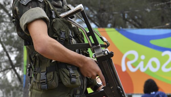 A Brasilian soldier stands guard near the Riocentro complex in Rio de Janeiro, on August 3, 2016, ahead of the Rio 2016 Olympic Games A Brasilian soldier stands guard near the Riocentro complex in Rio de Janeiro, on August 3, 2016, ahead of the Rio 2016 Olympic Games - Sputnik International