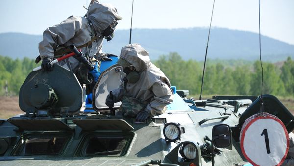 A nuclear, biological and chemical (NBC) reconnaissance crew during the regional stage of the Russian Army's Safe Environment 2016 NBC units contest in the Transbaikal region - Sputnik International