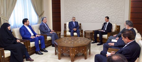 Syria's President Bashar al-Assad meets with Chairman of the Iranian parliament's National Security and Foreign Policy Commission, Alaeddin Boroujerdi (C-L),in this handout picture provided by SANA on August 4, 2016 Syria's President Bashar al-Assad meets with Chairman of the Iranian parliament's National Security and Foreign Policy Commission, Alaeddin Boroujerdi (C-L),in this handout picture provided by SANA on August 4, 2016 - Sputnik International