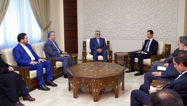 Syria's President Bashar al-Assad meets with Chairman of the Iranian parliament's National Security and Foreign Policy Commission, Alaeddin Boroujerdi (C-L),in this handout picture provided by SANA on August 4, 2016 - Sputnik International