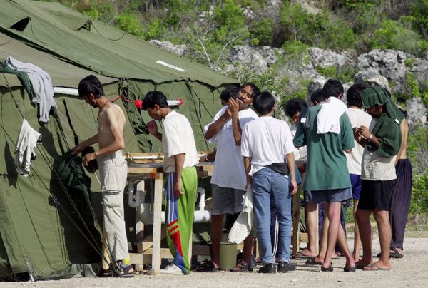 In this Sept. 21, 2001, file photo, men shave, brush their teeth and prepare for the day at a refugee camp on the Island of Nauru In this Sept. 21, 2001, file photo, men shave, brush their teeth and prepare for the day at a refugee camp on the Island of Nauru - Sputnik International