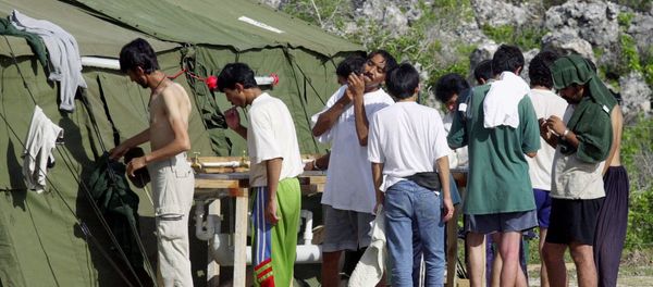 In this Sept. 21, 2001, file photo, men shave, brush their teeth and prepare for the day at a refugee camp on the Island of Nauru In this Sept. 21, 2001, file photo, men shave, brush their teeth and prepare for the day at a refugee camp on the Island of Nauru - Sputnik International