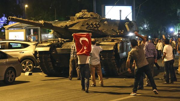 A tank moves into position as Turkish people attempt to stop them, in Ankara, Turkey, early Saturday, July 16, 2016 - Sputnik International