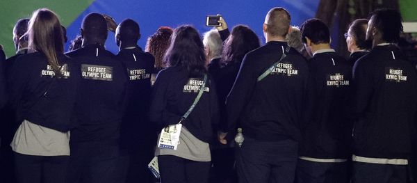 Members of the Refugee Olympic Team watch a welcome ceremony at the Olympic athletes village in Rio de Janeiro, Brazil, Wednesday, Aug. 3, 2016 Members of the Refugee Olympic Team watch a welcome ceremony at the Olympic athletes village in Rio de Janeiro, Brazil, Wednesday, Aug. 3, 2016 - Sputnik International