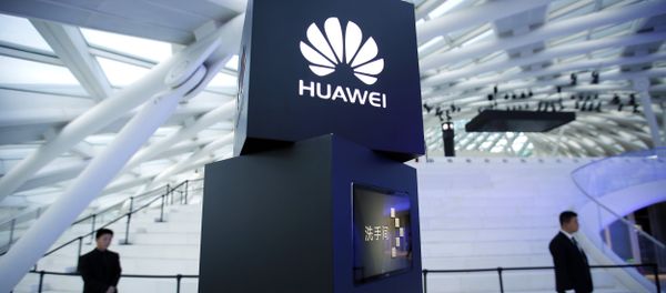 Security personnel stand near a pillar with the Huawei logo at a launch event for the Huawei MateBook in Beijing, Thursday, May 26, 2016 Security personnel stand near a pillar with the Huawei logo at a launch event for the Huawei MateBook in Beijing, Thursday, May 26, 2016 - Sputnik International
