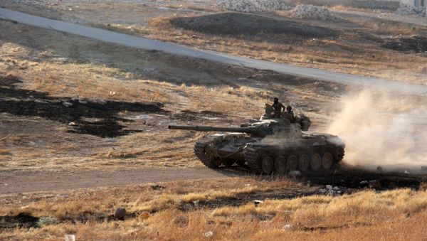 Opposition fighters drive a tank in the Al-Huweiz area on southern outskirts of Aleppo as they battle to break the government seige on the northen Syrian city on August 2, 2016 - Sputnik International