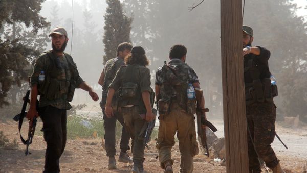 Fighters from the former Al-Nusra Front -- renamed Fateh al-Sham Front after breaking from Al-Qaeda -- advance at an armament school after they announced they seiged control of two military academies and a third military position on August 6, 2016, the Syrian Observatory for Human Rights said Fighters from the former Al-Nusra Front -- renamed Fateh al-Sham Front after breaking from Al-Qaeda -- advance at an armament school after they announced they seiged control of two military academies and a third military position on August 6, 2016, the Syrian Observatory for Human Rights said - Sputnik International