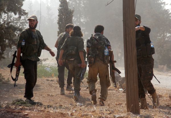 Fighters from the former Al-Nusra Front -- renamed Fateh al-Sham Front after breaking from Al-Qaeda -- advance at an armament school after they announced they seiged control of two military academies and a third military position on August 6, 2016, the Syrian Observatory for Human Rights said Fighters from the former Al-Nusra Front -- renamed Fateh al-Sham Front after breaking from Al-Qaeda -- advance at an armament school after they announced they seiged control of two military academies and a third military position on August 6, 2016, the Syrian Observatory for Human Rights said - Sputnik International