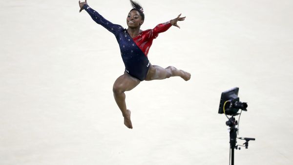 2016 Rio Olympics - Artistic Gymnastics - Preliminary - Women's Qualification - Subdivisions - Rio Olympic Arena - Rio de Janeiro, Brazil - 07/08/2016. Simone Biles (USA) of the U.S. competes on the floor exercise during the women's qualifications - Sputnik International