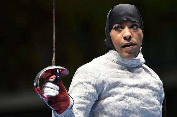 US Ibtihaj Muhammad reacts competing against France's Cecilia Berder in their women’s individual sabre qualifying bout as part of the fencing event of the Rio 2016 Olympic Games, on August 8, 2016, at the Carioca Arena 3, in Rio de Janeiro. US Ibtihaj Muhammad reacts competing against France's Cecilia Berder in their women’s individual sabre qualifying bout as part of the fencing event of the Rio 2016 Olympic Games, on August 8, 2016, at the Carioca Arena 3, in Rio de Janeiro. - Sputnik International