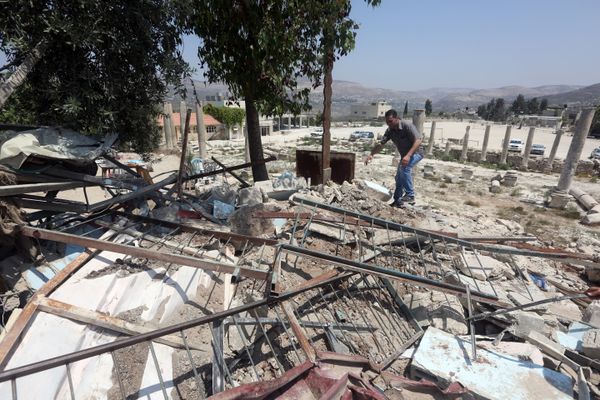 A Palestinian man walks amidst debris after Israeli authorities demolished a building in the village of Sebastia, near Nablus, in the Israeli-occupied West Bank on August 9, 2016 A Palestinian man walks amidst debris after Israeli authorities demolished a building in the village of Sebastia, near Nablus, in the Israeli-occupied West Bank on August 9, 2016 - Sputnik International