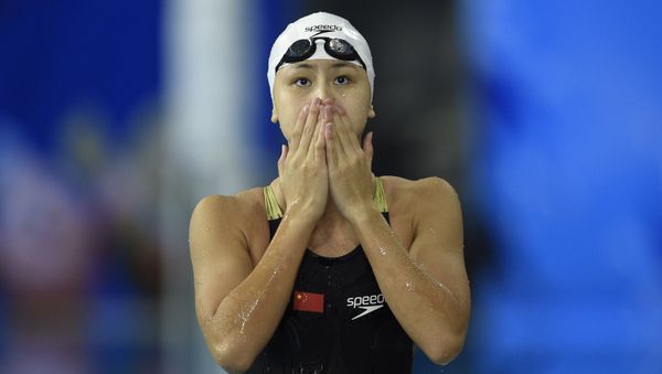 China's Chen Xinyi reacts after winning the final of the women's 50m freestyle swimming event during the 17th Asian Games at the Munhak Park Tae-hwan Aquatics Centre in Incheon on September 26, 2014 China's Chen Xinyi reacts after winning the final of the women's 50m freestyle swimming event during the 17th Asian Games at the Munhak Park Tae-hwan Aquatics Centre in Incheon on September 26, 2014 - Sputnik International