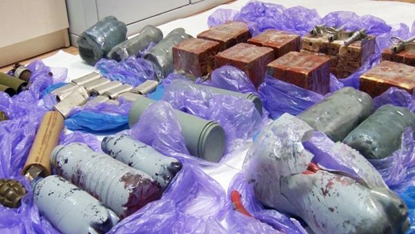 In this grab taken from a footage provided by Russian Federal Security Service Press Service, explosive devices and ammunition confiscated from a group that Russia's Federal Security Service (FSB) identified as Ukrainian 'saboteurs,' are placed on the floor by experts in Crimea on Thursday, Aug. 11, 2016 In this grab taken from a footage provided by Russian Federal Security Service Press Service, explosive devices and ammunition confiscated from a group that Russia's Federal Security Service (FSB) identified as Ukrainian 'saboteurs,' are placed on the floor by experts in Crimea on Thursday, Aug. 11, 2016 - Sputnik International