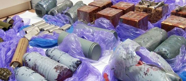 In this grab taken from a footage provided by Russian Federal Security Service Press Service, explosive devices and ammunition confiscated from a group that Russia's Federal Security Service (FSB) identified as Ukrainian 'saboteurs,' are placed on the floor by experts in Crimea on Thursday, Aug. 11, 2016 In this grab taken from a footage provided by Russian Federal Security Service Press Service, explosive devices and ammunition confiscated from a group that Russia's Federal Security Service (FSB) identified as Ukrainian 'saboteurs,' are placed on the floor by experts in Crimea on Thursday, Aug. 11, 2016 - Sputnik International