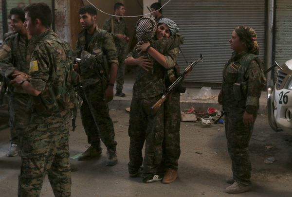 Syria Democratic Forces (SDF) female fighters embrace each other in the city of Manbij, in Aleppo Governorate, Syria, August 10, 2016 Syria Democratic Forces (SDF) female fighters embrace each other in the city of Manbij, in Aleppo Governorate, Syria, August 10, 2016 - Sputnik International