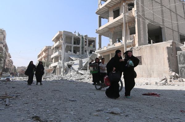 Women react as they walk along a street after they were evacuated with others by the Syria Democratic Forces (SDF) fighters from an Islamic State-controlled neighbourhood of Manbij, in Aleppo Governorate, Syria, August 12, 2016 Women react as they walk along a street after they were evacuated with others by the Syria Democratic Forces (SDF) fighters from an Islamic State-controlled neighbourhood of Manbij, in Aleppo Governorate, Syria, August 12, 2016 - Sputnik International
