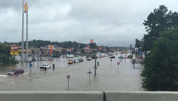 Floodwaters are seen on Range Road and I-12 in Denham Springs, Livingston Parish, Louisiana, U.S., August 13, 2016 Floodwaters are seen on Range Road and I-12 in Denham Springs, Livingston Parish, Louisiana, U.S., August 13, 2016 - Sputnik International