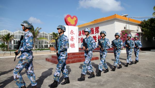 Soldiers of China's People's Liberation Army (PLA) Navy patrol at Fiery Cross Reef, in the Spratly Islands, known in China as the Nansha Islands (File) Soldiers of China's People's Liberation Army (PLA) Navy patrol at Fiery Cross Reef, in the Spratly Islands, known in China as the Nansha Islands (File) - Sputnik International