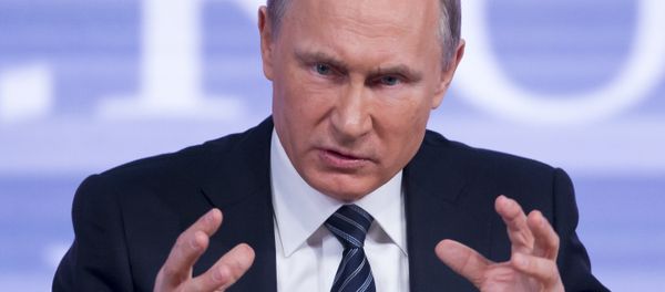 Russian President Vladimir Putin gestures during his annual end of year news conference in Moscow, Russia, Thursday, Dec. 17, 2015 - Sputnik International