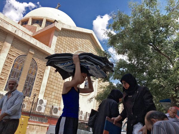 Refugees from block 1070 in south-western Aleppo who received aid in a Sunday Orthodox School by an Orthodox church in Aleppo - Sputnik International