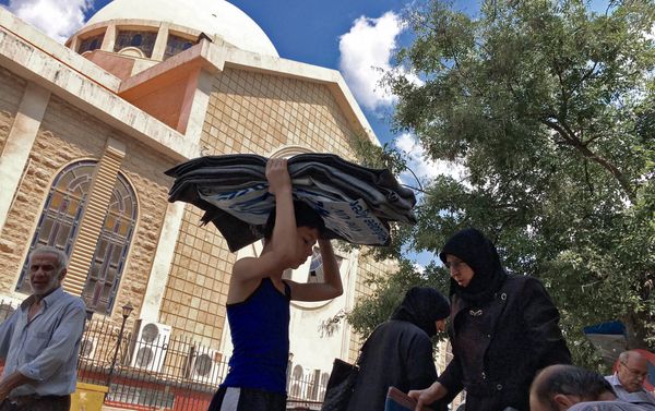 Refugees from block 1070 in south-western Aleppo who received aid in a Sunday Orthodox School by an Orthodox church in Aleppo - Sputnik International