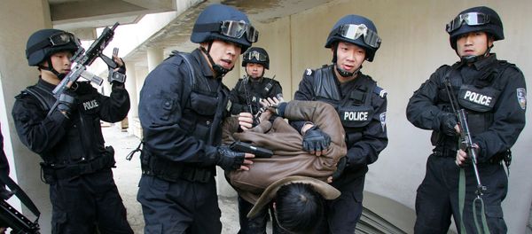 Members of the Special Weapons and Tactics Team (SWAT) of the Xian police force arrest a 'terrorist' during a drill at the Qujiang Waterworks in Xian, northwestern China's Shaanxi province. file photo Members of the Special Weapons and Tactics Team (SWAT) of the Xian police force arrest a 'terrorist' during a drill at the Qujiang Waterworks in Xian, northwestern China's Shaanxi province. file photo - Sputnik International