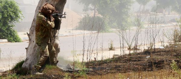 A member of forces loyal to Libya's UN-backed Government of National Accord (GNA), aims his weapon in al-Zaafaran neighbourhood as pro-government forces fight with Islamic State group (IS) fighters holed up in residential district two on August 14, 2016 in Sirte, east of the capital Tripoli - Sputnik International
