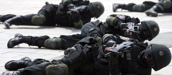 Special police forces demonstrate their craft during a drill to mark the launch of a training program on Beijing Olympic Games security held at the Beijing People's Police Institute on the outskirts of Beijing, China. file photo Special police forces demonstrate their craft during a drill to mark the launch of a training program on Beijing Olympic Games security held at the Beijing People's Police Institute on the outskirts of Beijing, China. file photo - Sputnik International