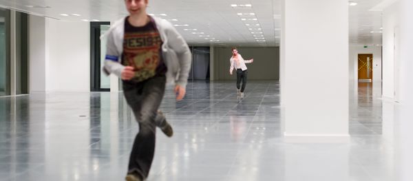 A zombie actor chases a man during a zombie game A zombie actor chases a man during a zombie game - Sputnik International