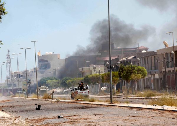 Fighters ride a pickup truck as smoke rises during a battle with Islamic State fighters in neighborhood Number Two in Sirte, Libya Fighters ride a pickup truck as smoke rises during a battle with Islamic State fighters in neighborhood Number Two in Sirte, Libya - Sputnik International