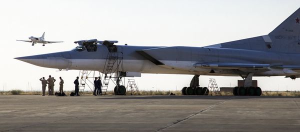 In this photo taken on Monday, Aug. 15, 2016, a Russian Tu-22M3 bomber stands on the tarmac while another plane lands at an air base near Hamedan, Iran. In this photo taken on Monday, Aug. 15, 2016, a Russian Tu-22M3 bomber stands on the tarmac while another plane lands at an air base near Hamedan, Iran. - Sputnik International