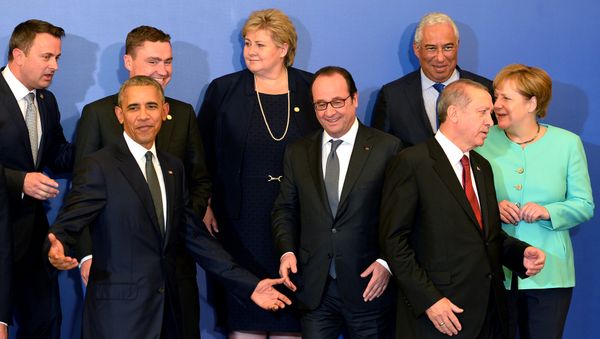 US President Barack Obama, France's President Francois Hollande, Turkish President Recep Tayyip Erdogan and German Chancellor Angela Merkel chat while posing for a family photo - Sputnik International