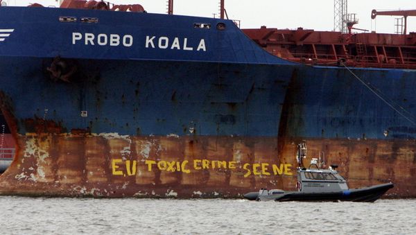 A police ship patrols near the Panamanian-registered vessel Probo Koala, suspected of dumping toxic waste in waters off Ivory Coast A police ship patrols near the Panamanian-registered vessel Probo Koala, suspected of dumping toxic waste in waters off Ivory Coast - Sputnik International