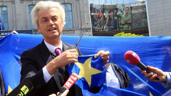 Dutch populist and euro-sceptic Geert Wilders displays a yellow star he cut out of the EU flag, during news conference, in front of the European Parliament in Brussels (File) Dutch populist and euro-sceptic Geert Wilders displays a yellow star he cut out of the EU flag, during news conference, in front of the European Parliament in Brussels (File) - Sputnik International