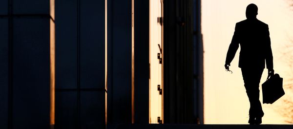 A worker arrives at his office in the Canary Wharf business district in London (File) - Sputnik International