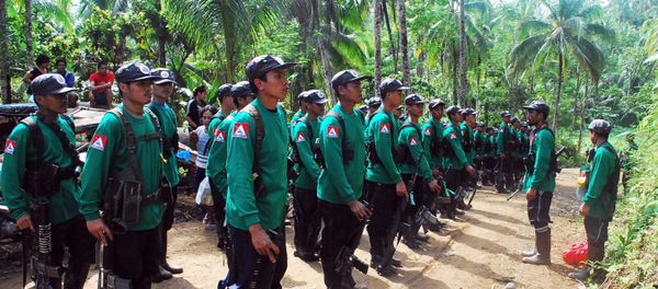 In this file photograph taken on December 26, 2009, New People's Army (NPA) rebels stand to attention during the 41st founding anniversary of the Communist Party of the Philippines at an unspecified location in the hinterlands of Surigao del Sur province, in the southern Philippine island of Mindanao. In this file photograph taken on December 26, 2009, New People's Army (NPA) rebels stand to attention during the 41st founding anniversary of the Communist Party of the Philippines at an unspecified location in the hinterlands of Surigao del Sur province, in the southern Philippine island of Mindanao. - Sputnik International