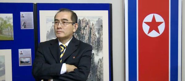 In a video grab created on August 17, 2016 taken from footage recorded by AFPTV on November 3, 2014 deputy ambassador at the North Korean embassy in London, Thae Yong-ho, stands in front of an artwork during a photocall to view an exhibition of North Korean art at the North Korean embassy in west London In a video grab created on August 17, 2016 taken from footage recorded by AFPTV on November 3, 2014 deputy ambassador at the North Korean embassy in London, Thae Yong-ho, stands in front of an artwork during a photocall to view an exhibition of North Korean art at the North Korean embassy in west London - Sputnik International