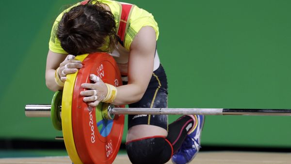 Hiromi Miyake, of Japan, celebrates after a lift in the women's 48kg weightlifting competition at the 2016 Summer Olympics in Rio de Janeiro, Brazil, Saturday, Aug. 6, 2016 - Sputnik International