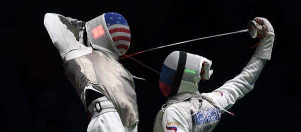 US Gerek Meinhardt (L) competes against Russia's Artur Akhmatkhuzin during the men’s team foil semi-final bout between Russia and US as part of the fencing event of the Rio 2016 Olympic Games, on August 12, 2016, at the Carioca Arena 3, in Rio de Janeiro US Gerek Meinhardt (L) competes against Russia's Artur Akhmatkhuzin during the men’s team foil semi-final bout between Russia and US as part of the fencing event of the Rio 2016 Olympic Games, on August 12, 2016, at the Carioca Arena 3, in Rio de Janeiro - Sputnik International